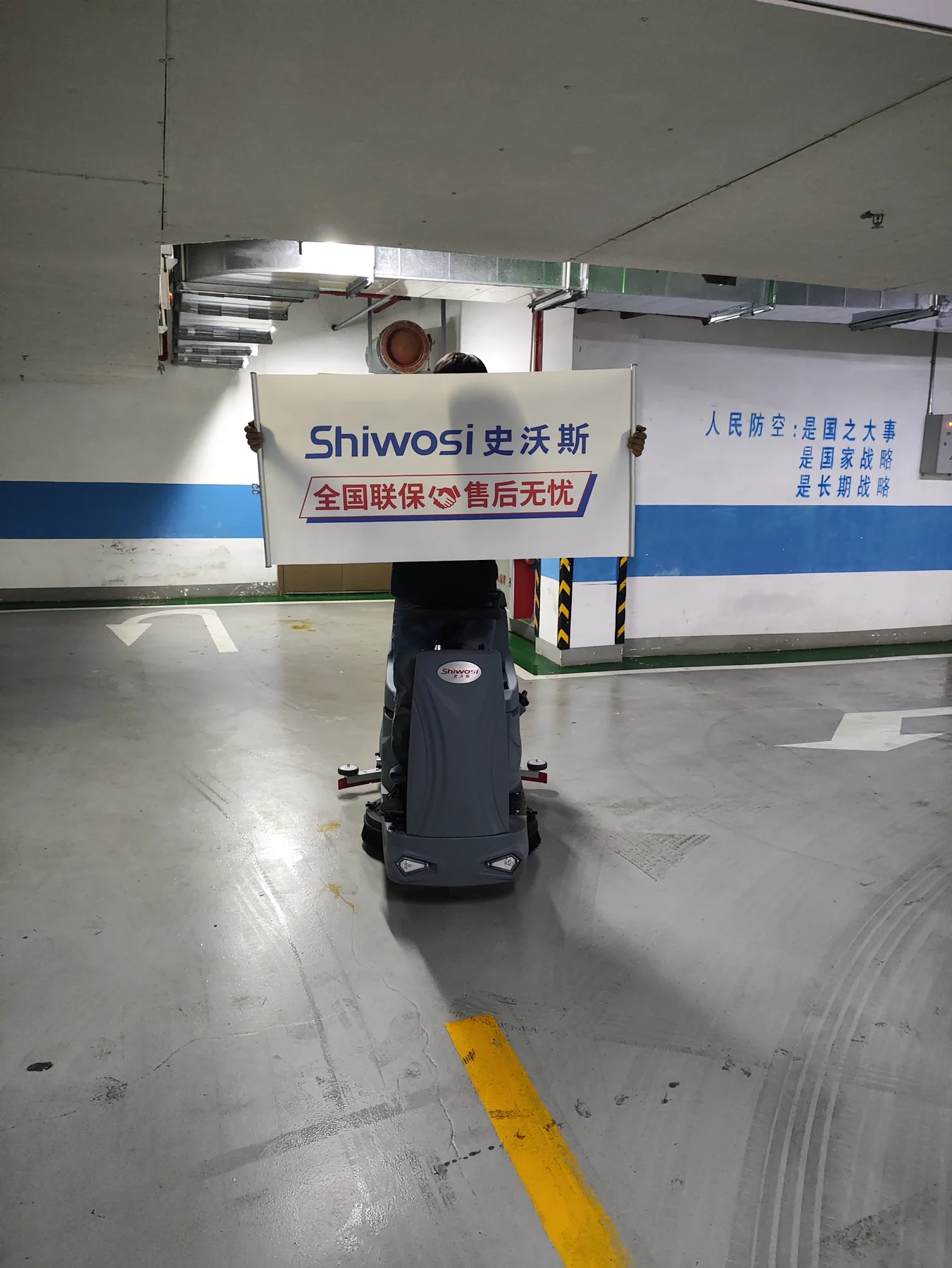 Ride-On Floor Scrubber in an Underground Parking Facility
